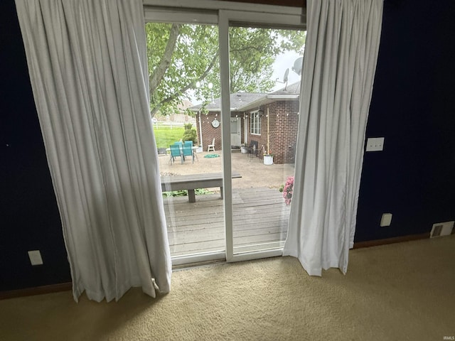 5522 N State Rd 57, Petersburg, IN 47567 - doorway to outside featuring carpet flooring, healthy amount of natural light, and baseboards
