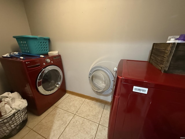 5522 N State Rd 57, Petersburg, IN 47567 - washroom with washing machine and clothes dryer, light tile patterned floors, and baseboards