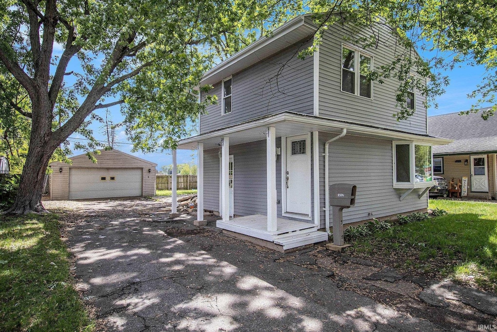 2320 Normandy Dr, Mishawaka, IN 46545 - view of front of home featuring a garage, an outbuilding, and covered porch
