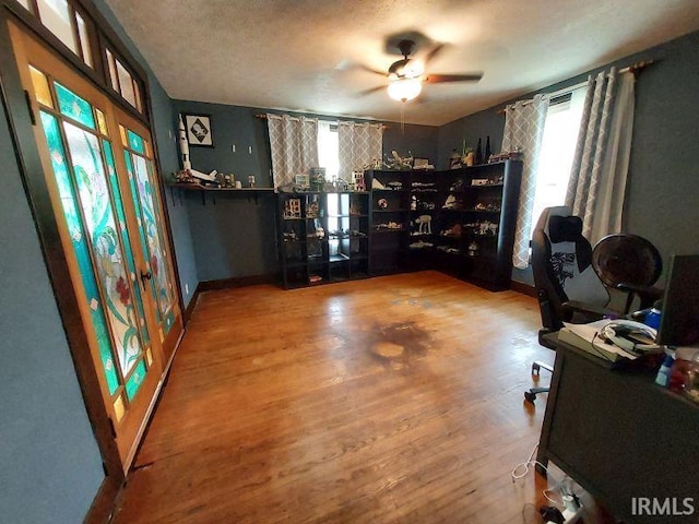 306 E 8th St, Jasper, IN 47546 - office area featuring ceiling fan, wood finished floors, baseboards, and a textured ceiling