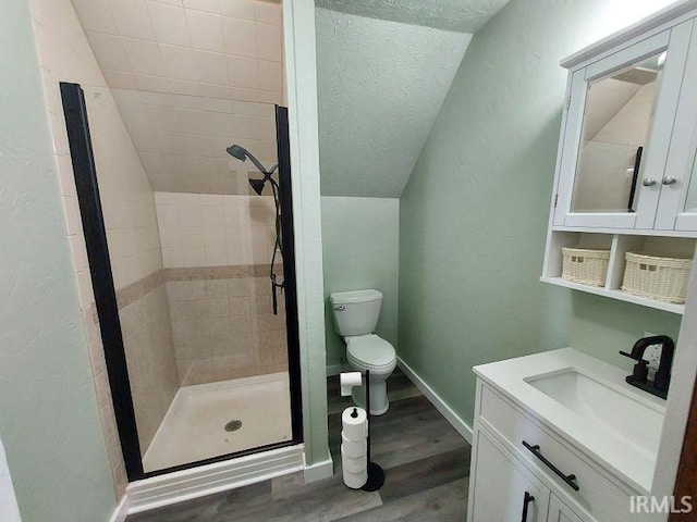 306 E 8th St, Jasper, IN 47546 - full bathroom featuring a stall shower, wood finished floors, toilet, vanity, and baseboards