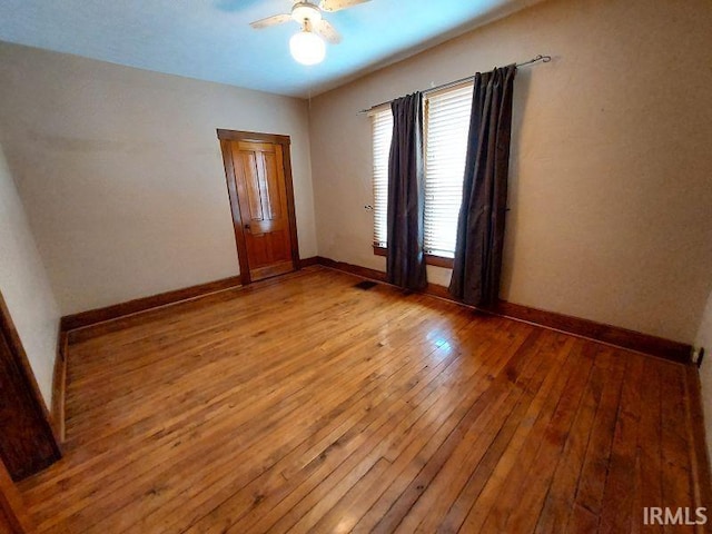 306 E 8th St, Jasper, IN 47546 - empty room featuring light wood-type flooring, ceiling fan, and baseboards