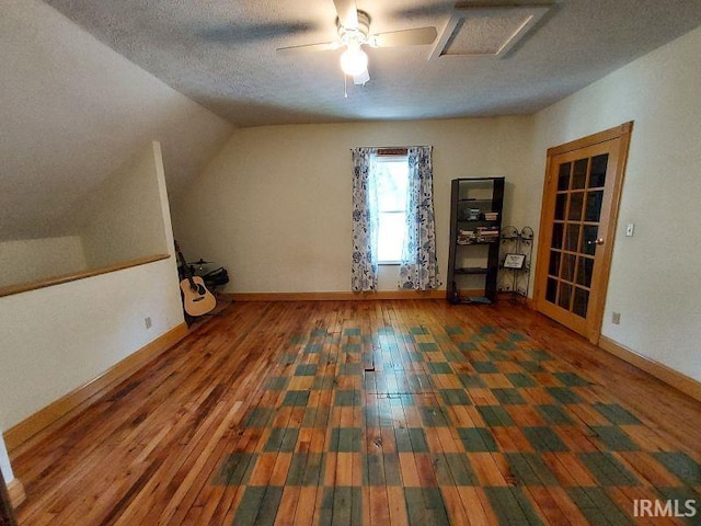 306 E 8th St, Jasper, IN 47546 - additional living space featuring wood-type flooring, baseboards, a textured ceiling, vaulted ceiling, and ceiling fan