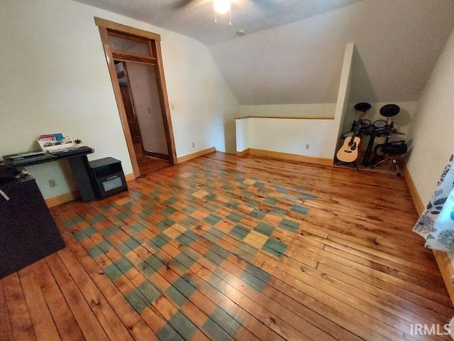 306 E 8th St, Jasper, IN 47546 - bonus room with hardwood / wood-style floors, lofted ceiling, ceiling fan, and baseboards