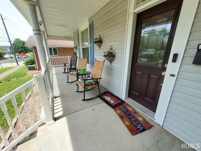 306 E 8th St, Jasper, IN 47546 - property entrance with a porch