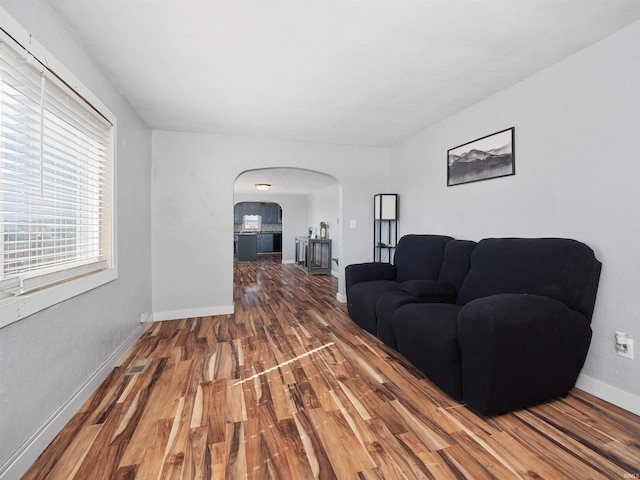 3780 S 550 E, Hamilton, IN 46742 - living area with arched walkways, wood finished floors, and baseboards