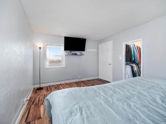 3780 S 550 E, Hamilton, IN 46742 - bedroom featuring wood finished floors, baseboards, a spacious closet, a closet, and a textured wall