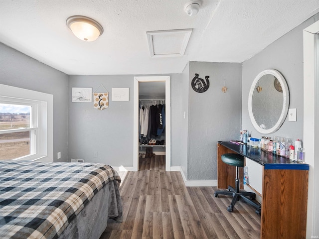 3780 S 550 E, Hamilton, IN 46742 - bedroom featuring attic access, wood finished floors, baseboards, a textured ceiling, and a closet