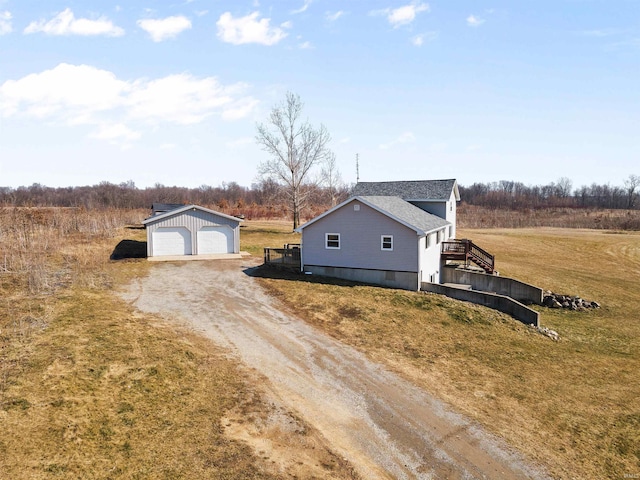 3780 S 550 E, Hamilton, IN 46742 - view of front of house with driveway, an outbuilding, a garage, a front yard, and a shingled roof