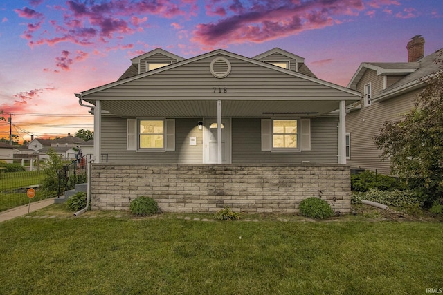 718 W 8th St, Mishawaka, IN 46544 - view of front of property with a lawn, a porch, and stone siding
