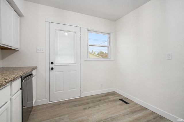 718 W 8th St, Mishawaka, IN 46544 - doorway featuring light wood finished floors and baseboards