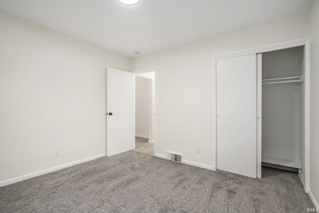 718 W 8th St, Mishawaka, IN 46544 - unfurnished bedroom featuring carpet, a closet, and baseboards
