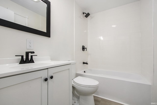 718 W 8th St, Mishawaka, IN 46544 - full bathroom with vanity, toilet, shower / tub combination, and wood finished floors