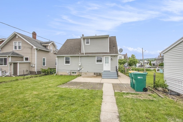 718 W 8th St, Mishawaka, IN 46544 - rear view of house with a patio, roof with shingles, a residential view, and entry steps