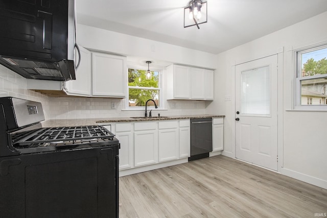718 W 8th St, Mishawaka, IN 46544 - kitchen with gas range, a sink, dishwashing machine, decorative backsplash, and healthy amount of natural light