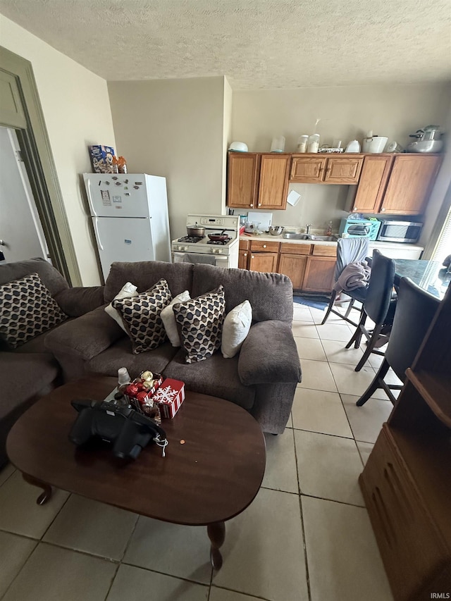 1214 Spear St, Logansport, IN 46947 - living room with light tile patterned flooring and a textured ceiling