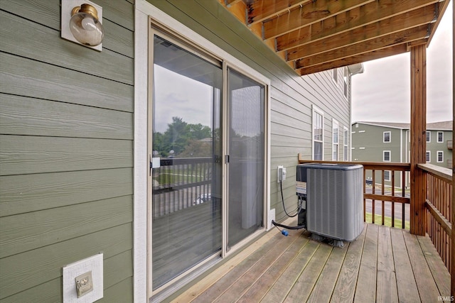 3220 E John Hinkle Pl Unit F, Bloomington, IN 47408 - wooden terrace featuring central air condition unit