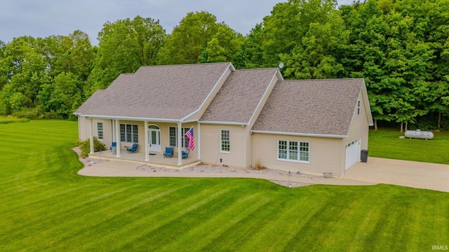 11600 S 700 E, Lafontaine, IN 46940 - back of property featuring a lawn, driveway, covered porch, and a shingled roof