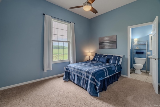 11600 S 700 E, Lafontaine, IN 46940 - carpeted bedroom with baseboards, ensuite bath, and a ceiling fan
