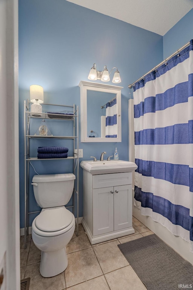 11600 S 700 E, Lafontaine, IN 46940 - bathroom with toilet, tile patterned floors, vanity, a shower with curtain, and baseboards