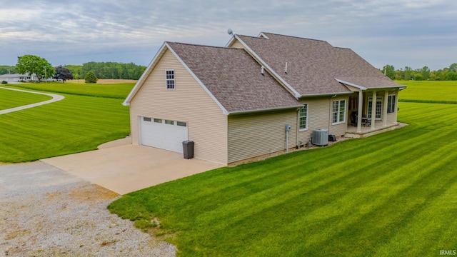 11600 S 700 E, Lafontaine, IN 46940 - view of home's exterior featuring concrete driveway, cooling unit, a lawn, and a shingled roof