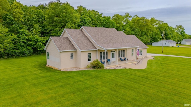 11600 S 700 E, Lafontaine, IN 46940 - rear view of property with a lawn, a patio, and a shingled roof