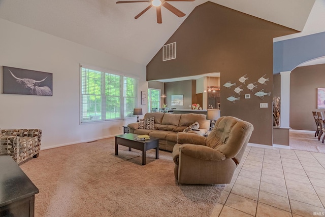 11600 S 700 E, Lafontaine, IN 46940 - living area featuring ceiling fan, high vaulted ceiling, arched walkways, baseboards, and light tile patterned floors