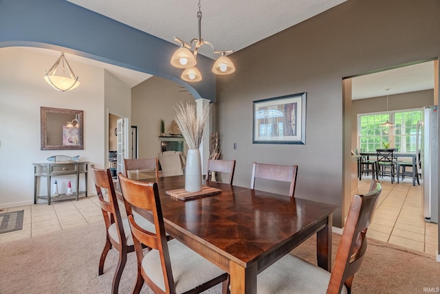 11600 S 700 E, Lafontaine, IN 46940 - dining room with arched walkways, light tile patterned floors, light colored carpet, and baseboards