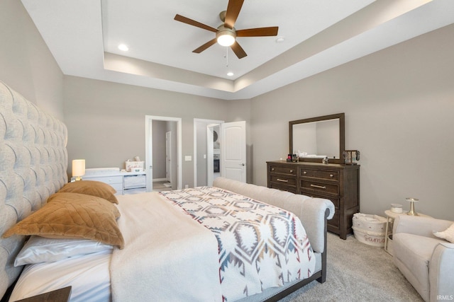 13909 Stone Table Blvd, Fort Wayne, IN 46845 - bedroom with light carpet, recessed lighting, a ceiling fan, and a tray ceiling