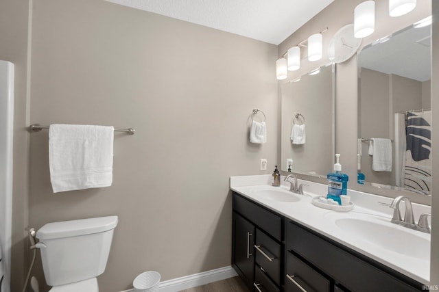 13909 Stone Table Blvd, Fort Wayne, IN 46845 - full bath featuring double vanity, toilet, and baseboards