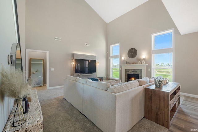13909 Stone Table Blvd, Fort Wayne, IN 46845 - living room with high vaulted ceiling, a fireplace, and baseboards