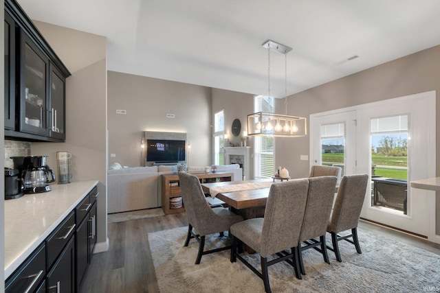 13909 Stone Table Blvd, Fort Wayne, IN 46845 - dining area featuring wood finished floors and a fireplace