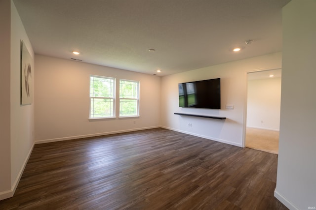 1208 Mount Isa Pl, Fort Wayne, IN 46845 - unfurnished living room with dark wood-type flooring, baseboards, and recessed lighting