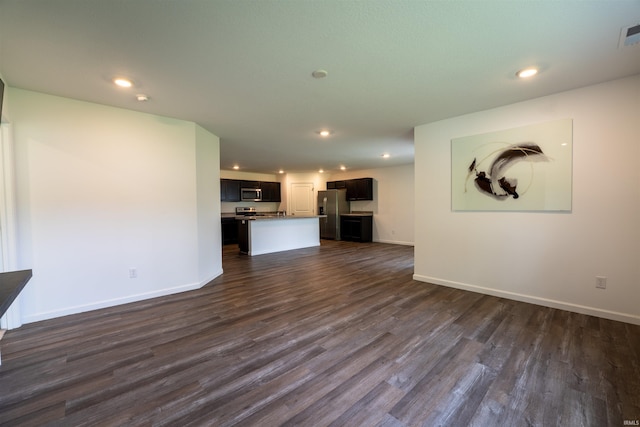1208 Mount Isa Pl, Fort Wayne, IN 46845 - unfurnished living room with dark wood-style flooring, recessed lighting, and baseboards