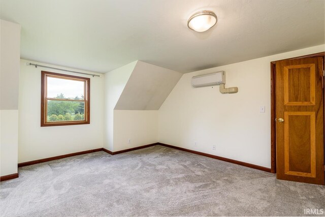 7819 Greenwell Rd, Churubusco, IN 46723 - additional living space featuring a wall unit AC, carpet flooring, and baseboards
