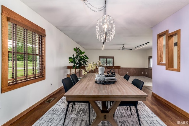 7819 Greenwell Rd, Churubusco, IN 46723 - dining area with a chandelier, a ceiling fan, dark wood-style floors, and track lighting