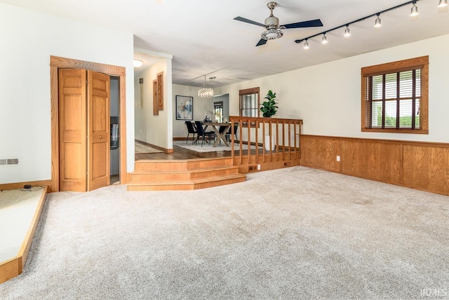 7819 Greenwell Rd, Churubusco, IN 46723 - spare room featuring carpet flooring, ceiling fan, a chandelier, and rail lighting