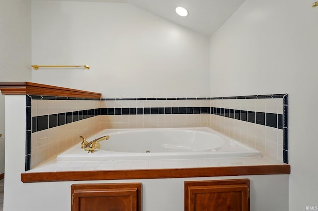 611 Big Valley Ct, Huntertown, IN 46748 - full bathroom featuring a jetted tub and lofted ceiling