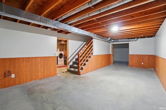 611 Big Valley Ct, Huntertown, IN 46748 - finished below grade area featuring washer / dryer, a wainscoted wall, stairway, and wooden walls