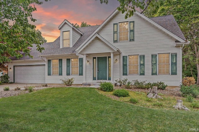 51062 Oak Hollow Ln, South Bend, IN 46628 - view of front of house with a shingled roof, a garage, a front yard, and driveway