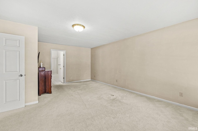 51062 Oak Hollow Ln, South Bend, IN 46628 - spare room featuring light colored carpet and baseboards