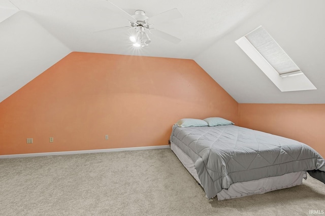 51062 Oak Hollow Ln, South Bend, IN 46628 - bedroom with vaulted ceiling, carpet flooring, a skylight, ceiling fan, and baseboards