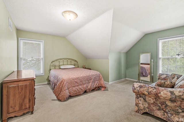 51062 Oak Hollow Ln, South Bend, IN 46628 - bedroom featuring light carpet, lofted ceiling, and baseboards