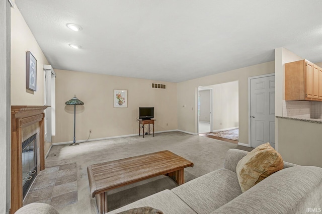 51062 Oak Hollow Ln, South Bend, IN 46628 - living area featuring light colored carpet, baseboards, and a tiled fireplace