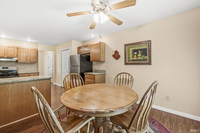 51062 Oak Hollow Ln, South Bend, IN 46628 - dining space with baseboards, dark wood-style floors, a ceiling fan, and recessed lighting
