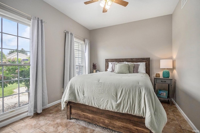 51405 Amesburry Way, Granger, IN 46530 - tiled bedroom with baseboards and a ceiling fan