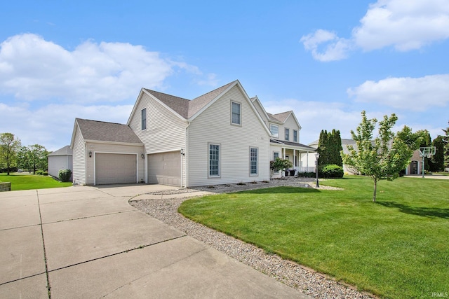 51405 Amesburry Way, Granger, IN 46530 - view of front of house featuring driveway, a front lawn, and an attached garage