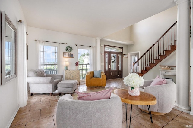 51405 Amesburry Way, Granger, IN 46530 - tiled living area featuring ornate columns, baseboards, and stairs