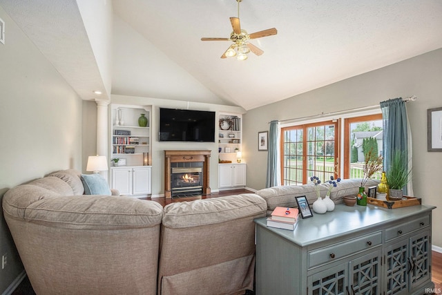 51405 Amesburry Way, Granger, IN 46530 - living area featuring ceiling fan, baseboards, dark wood-style floors, a fireplace with flush hearth, and vaulted ceiling