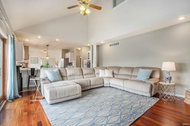 51405 Amesburry Way, Granger, IN 46530 - living area featuring ceiling fan, wood finished floors, high vaulted ceiling, recessed lighting, and baseboards